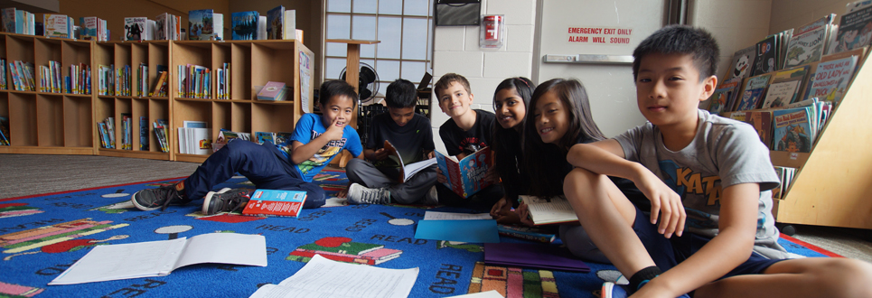 Students reading books in the Learning Commons